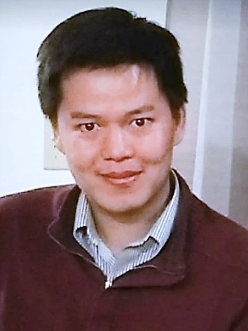 Chang smiling at the camera